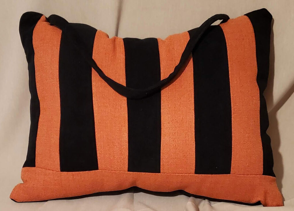 The burnt orange midnight handle pillow