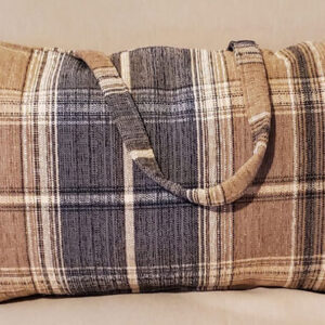 The sleek plaid handle pillow