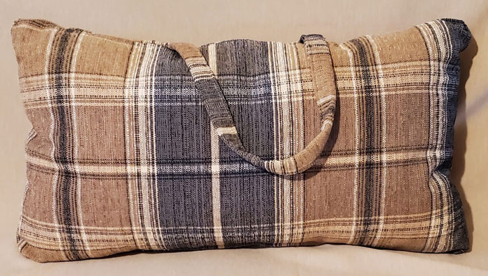 The sleek plaid handle pillow