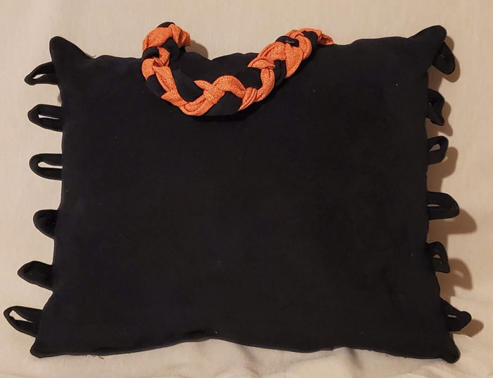 black midnight fringe handle pillow